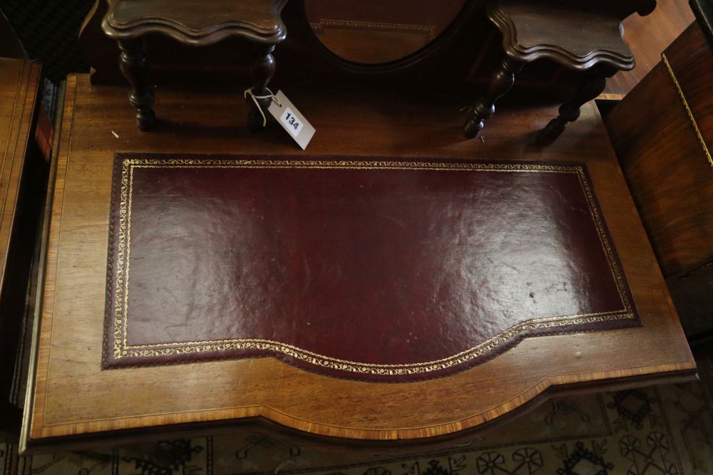 A late Victorian satinwood banded mahogany bowfront writing table, width 76cm, depth 45cm, height 115cm